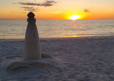 Slide Show Anna-Maria-Island-sunset-with-sand-lighthouse