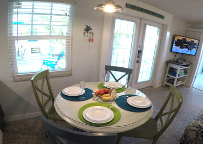 Unit-4-Dining-table-with-court-yard-and-swiming-pool-view-from-kitchen